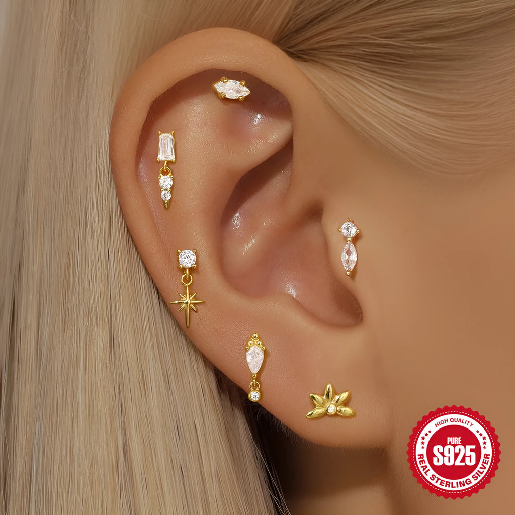 Sterling silver ear stud with a hanging gold-tone tassel charm on a white background.