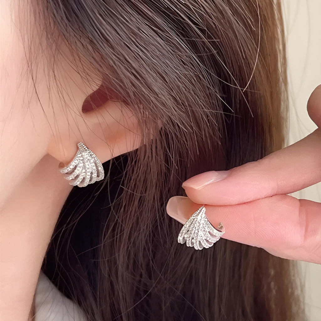 A pair of geometric line design drop earrings with a platinum colour finish.