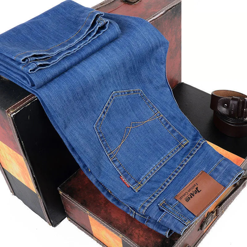 Men's loose straight casual work stretch jeans in blue elastic option with mid-waist and straight leg