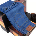 Men's loose straight casual work stretch jeans in blue elastic option with mid-waist and straight leg