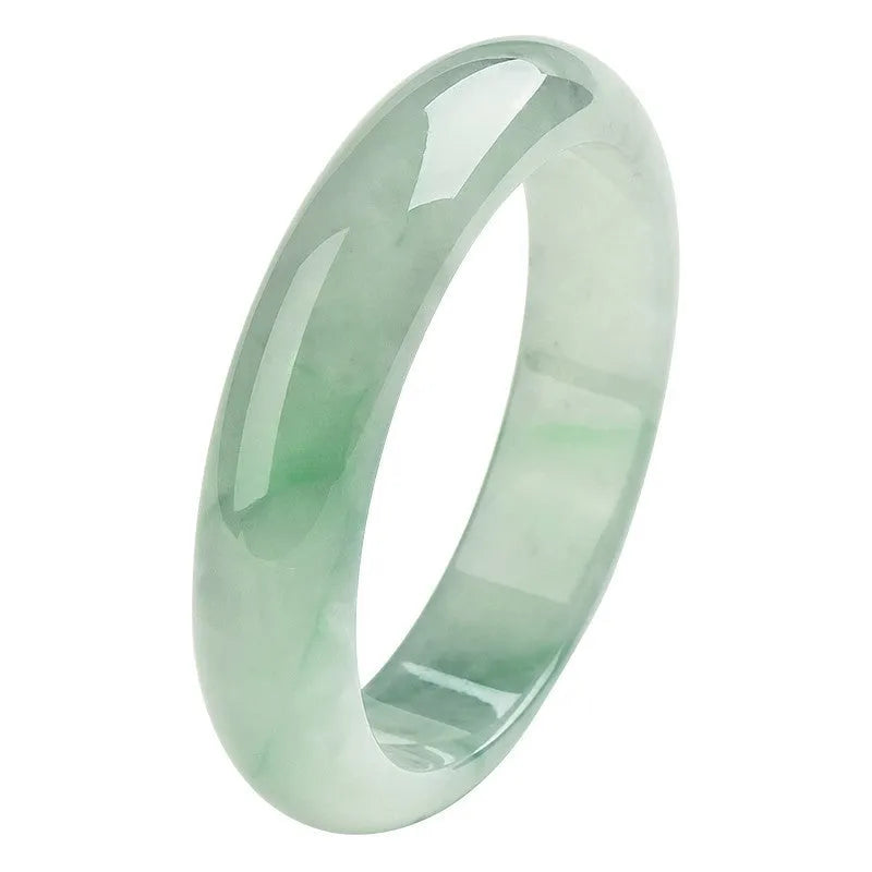 Light green jade bracelet showing natural stone material on wrist
