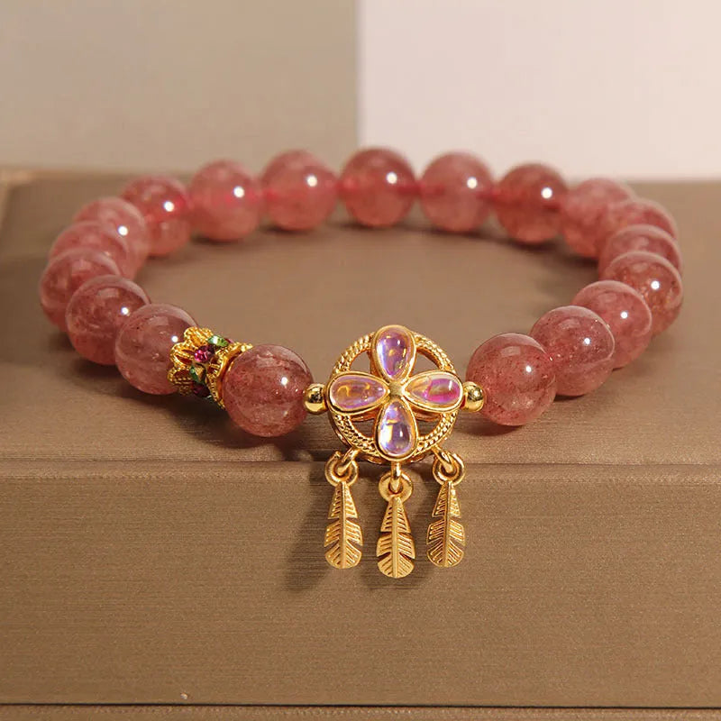 Women's crystal bracelet with strawberry quartz four-leaf dream catcher ball pendant