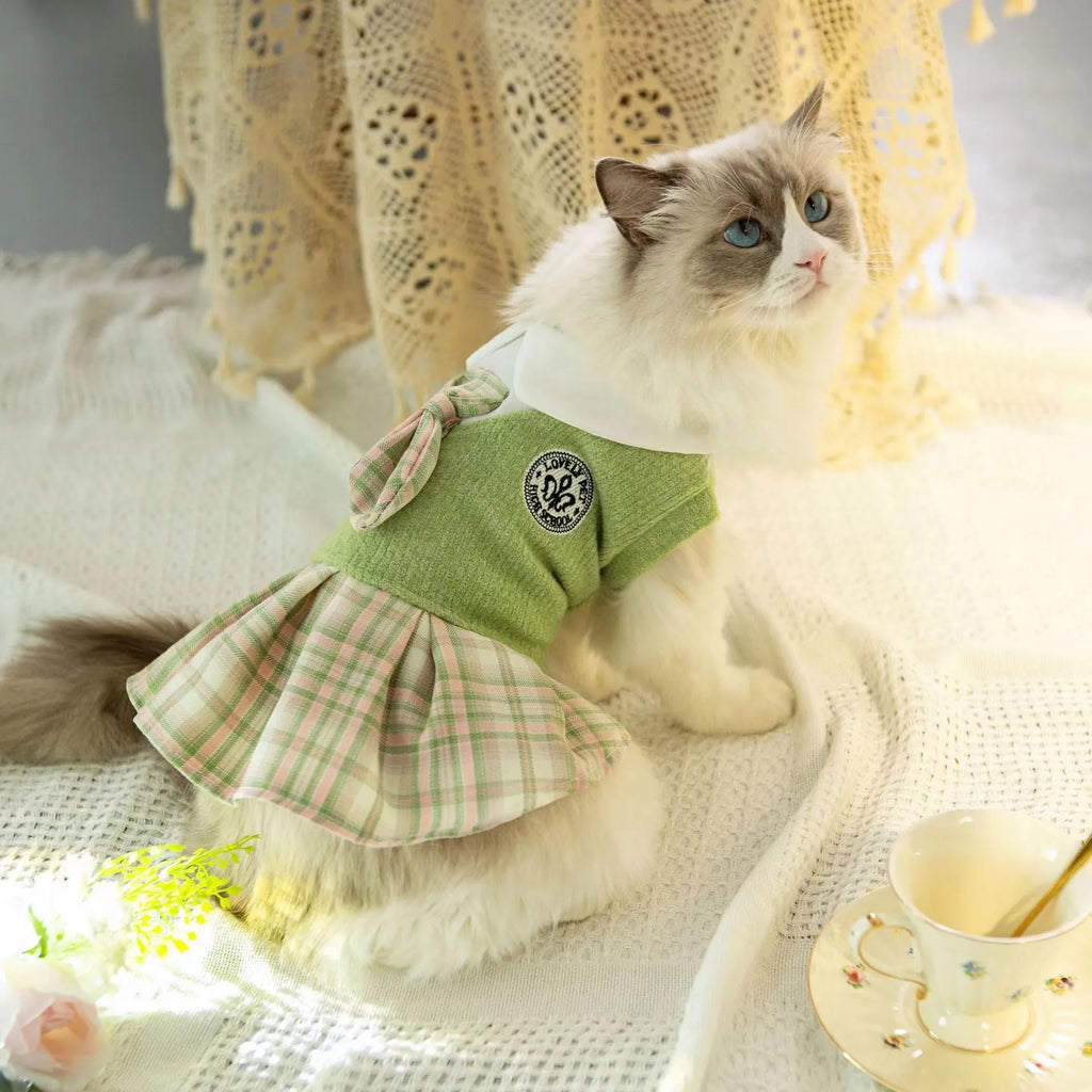 A pink tartan princess-style skirt for small dogs or cats, shown alongside blue and green colour options.
