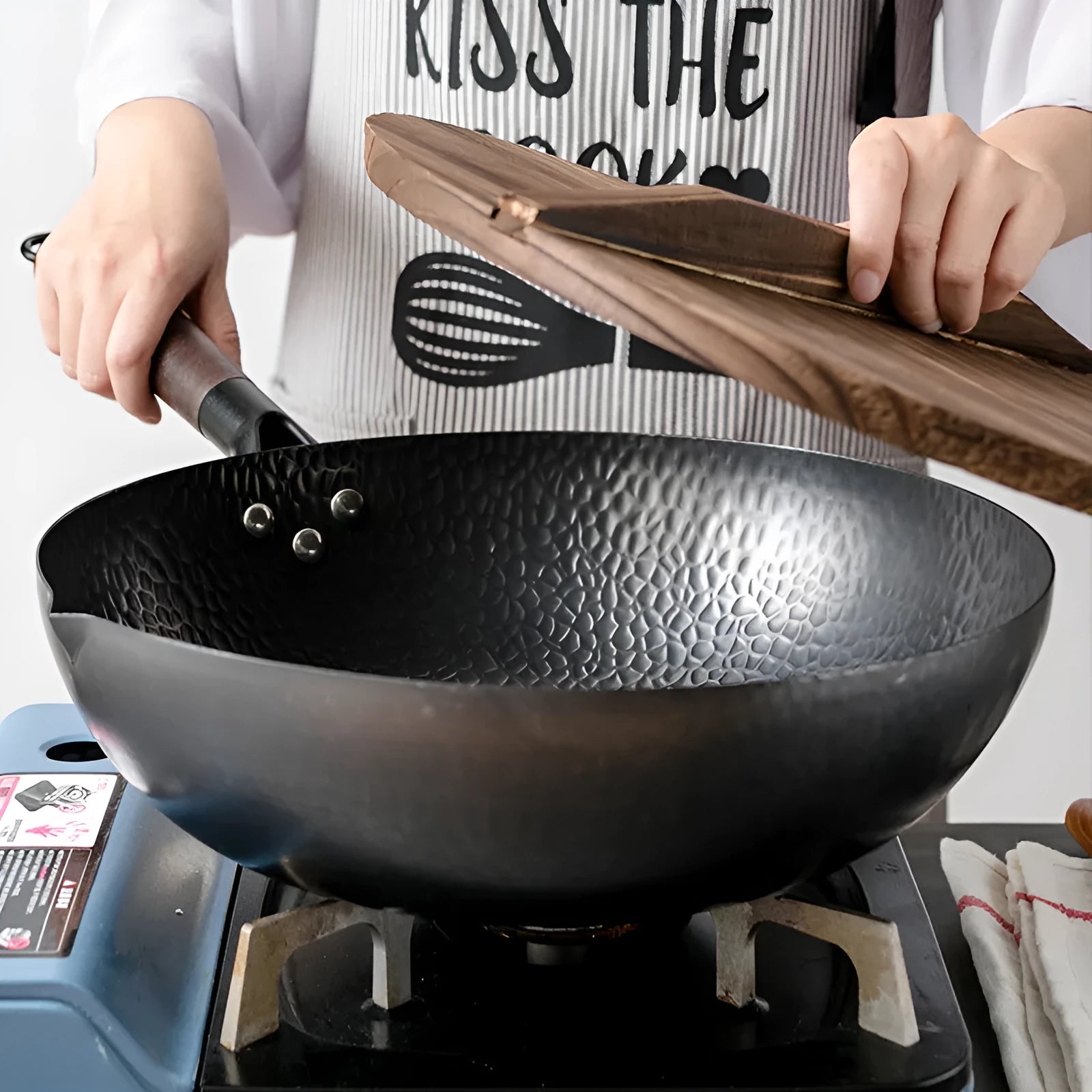 Traditional black iron wok with wooden handle measuring 40cm diameter