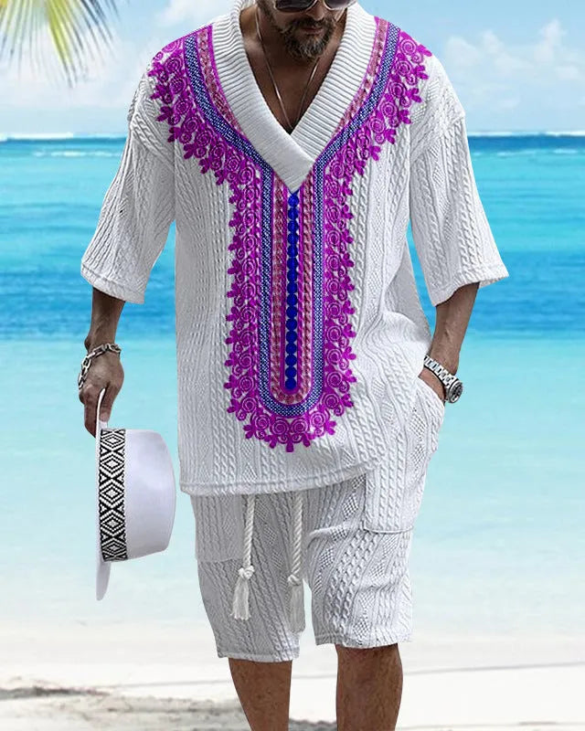 Man wearing a printed drop-shoulder knitted top and matching shorts from a leisure suit set.