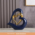 Modern white porcelain heart ornament on display in a choice of eight metallic and coloured finishes.