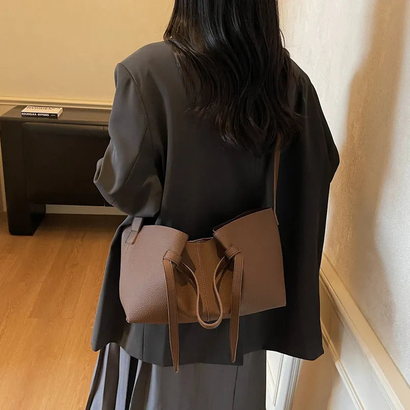 Large capacity one-shoulder crossbody bag in soft PU leather with sewing line detail, black colour option