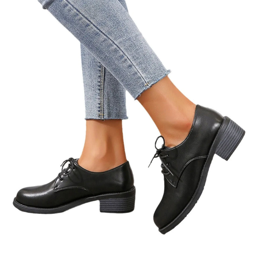 Black women's professional work shoes with chunky heel and low top design