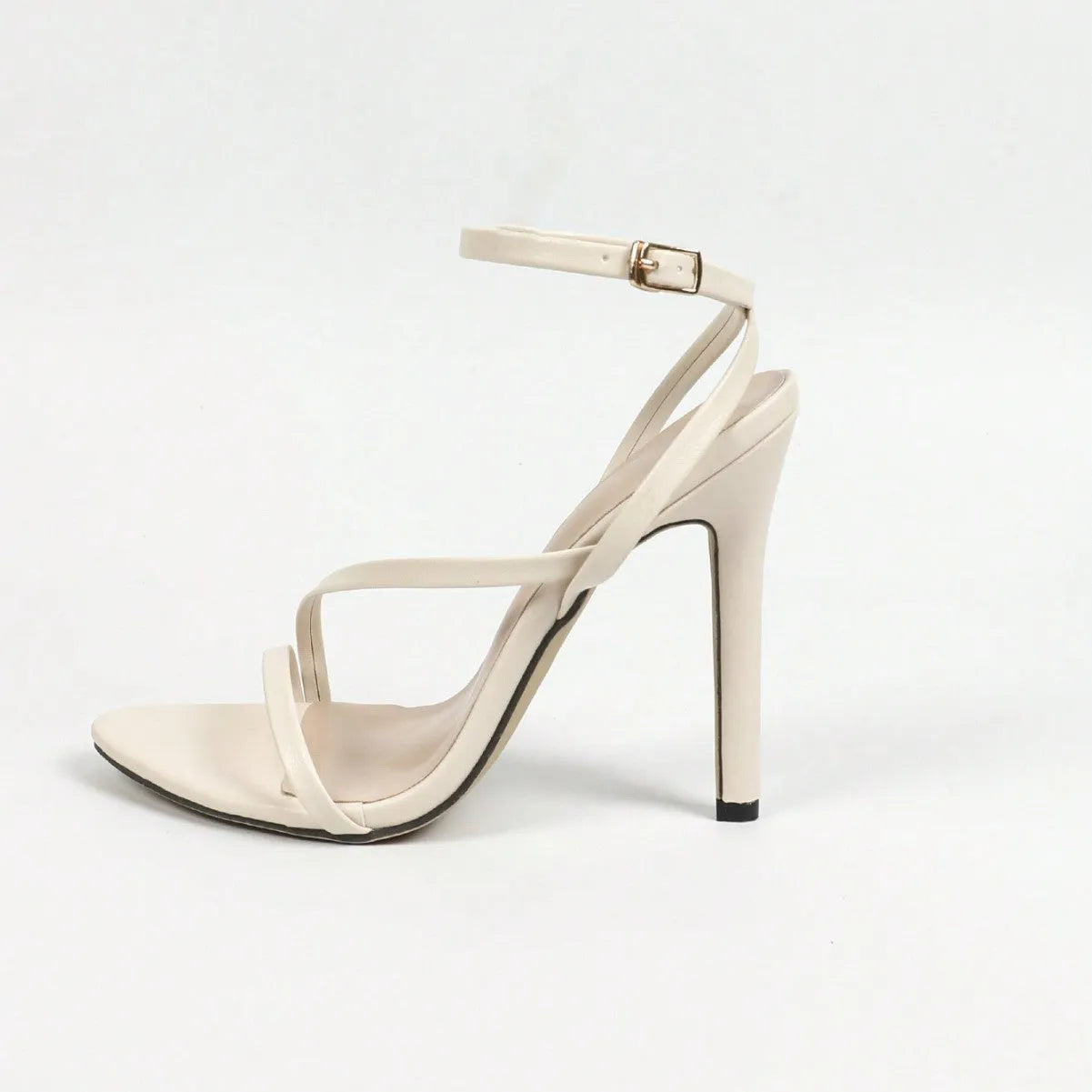 Women's gold open toe sandals with cross ankle straps and round toe design on rubber sole