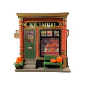 Small cartoon-style Christmas house night light ornament on a surface.