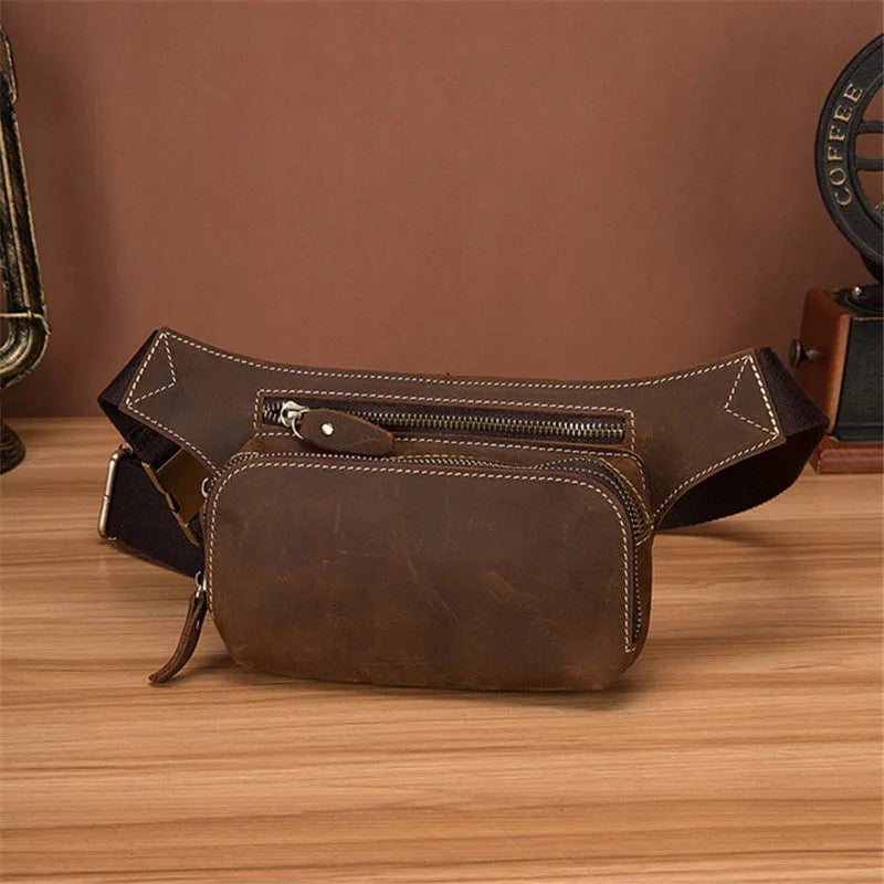 Brown men's cowhide sports waist bag shown from the front, highlighting the pull closure and compact 30cm wide design.