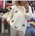 Women's long sleeve knitted sweater with 3D stereo pattern in pink, loose fit pullover style