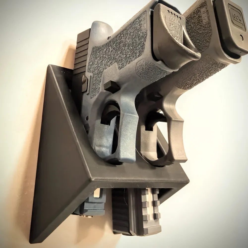 Black punk-style plastic pistol stand for gun display