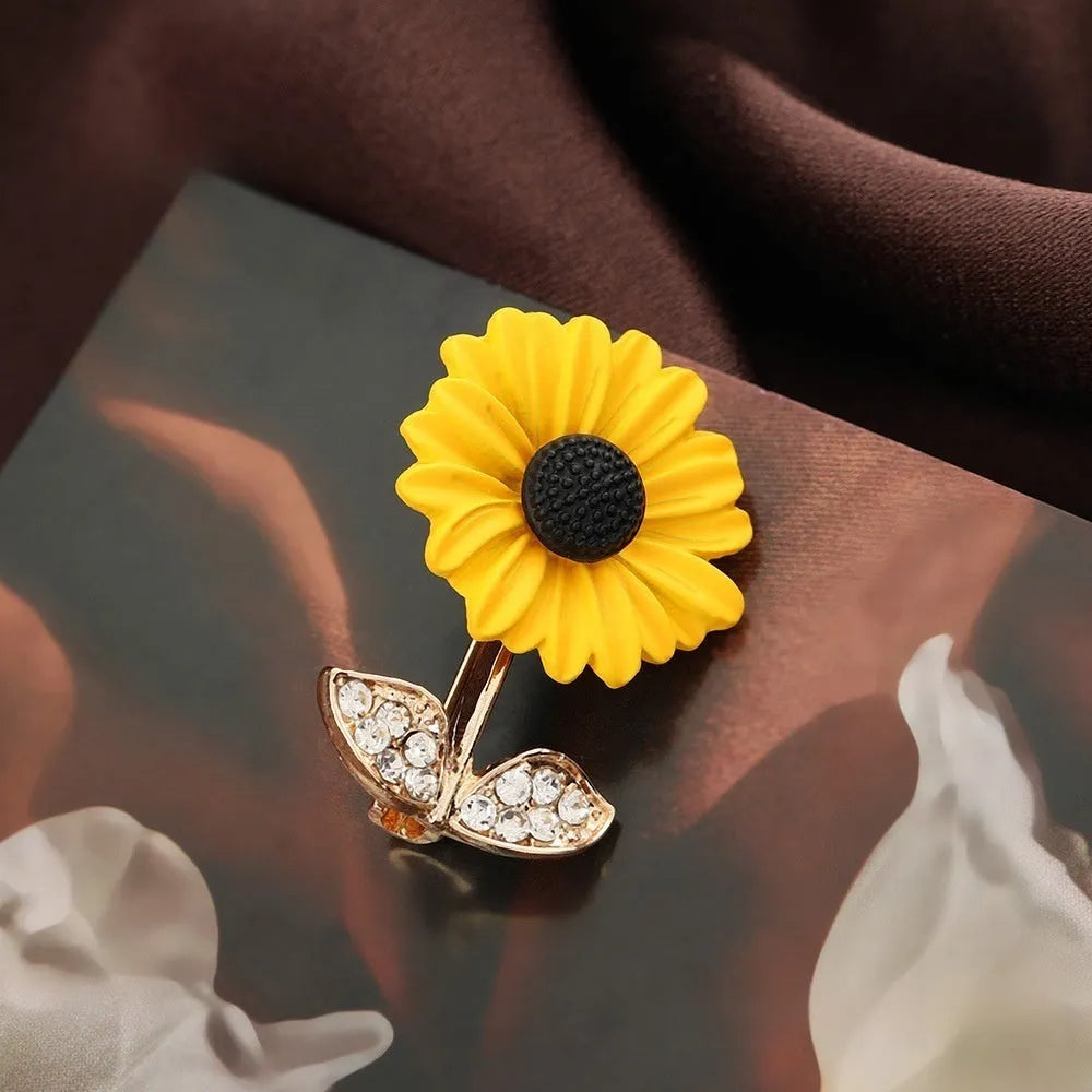 Close-up of a sunflower brooch pin for women, alloy electroplated finish, 2.4 cm by 3.1 cm size