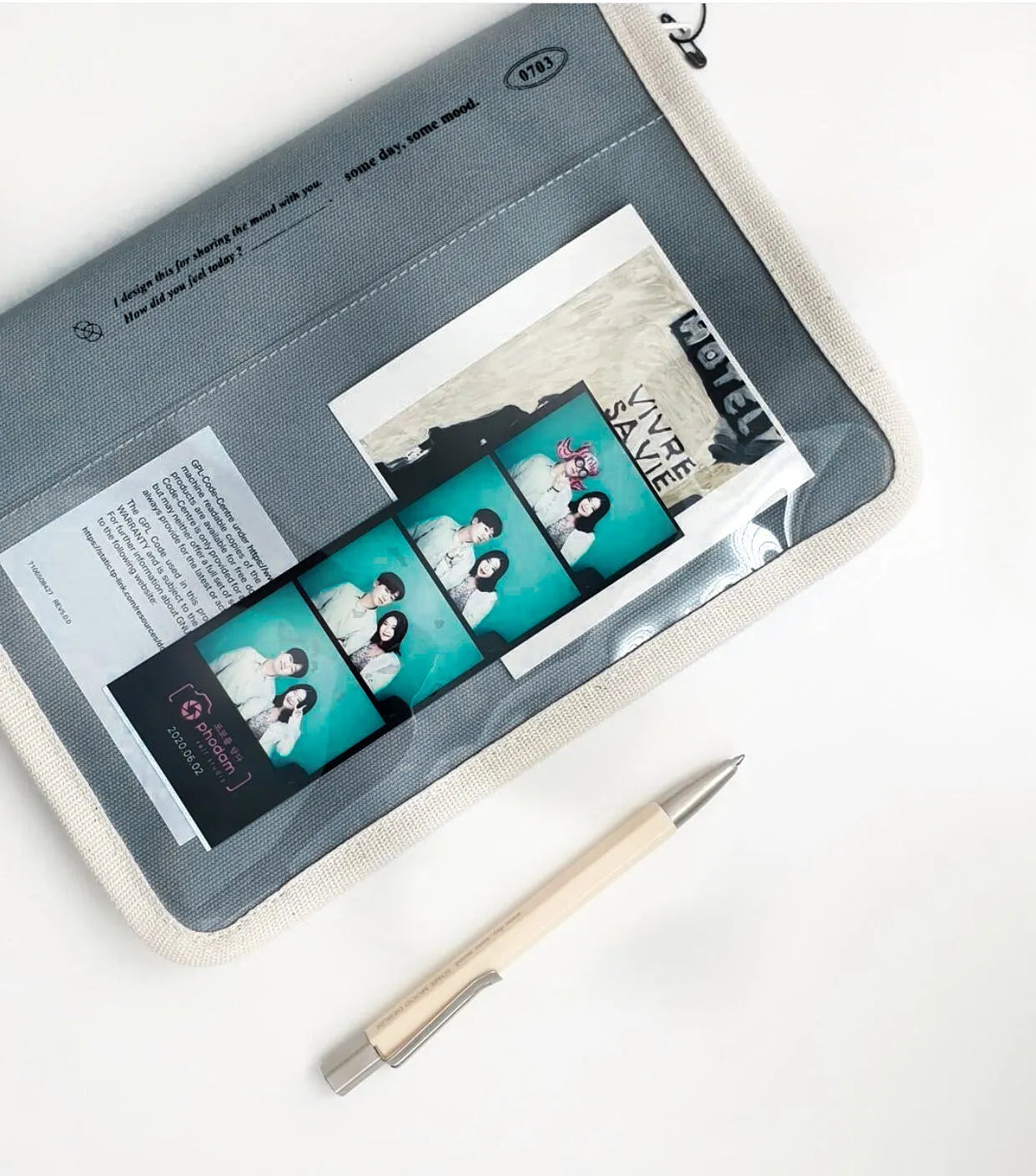 Canvas tablet storage bag with zipper opening and soft handle designed for 12-inch devices, shown in black and white colours