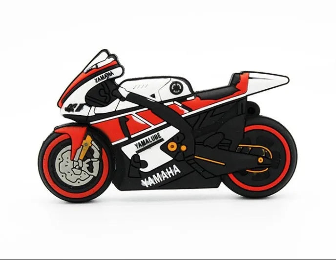 Cartoon motorcycle USB drive with red white wristband and key ring on a surface