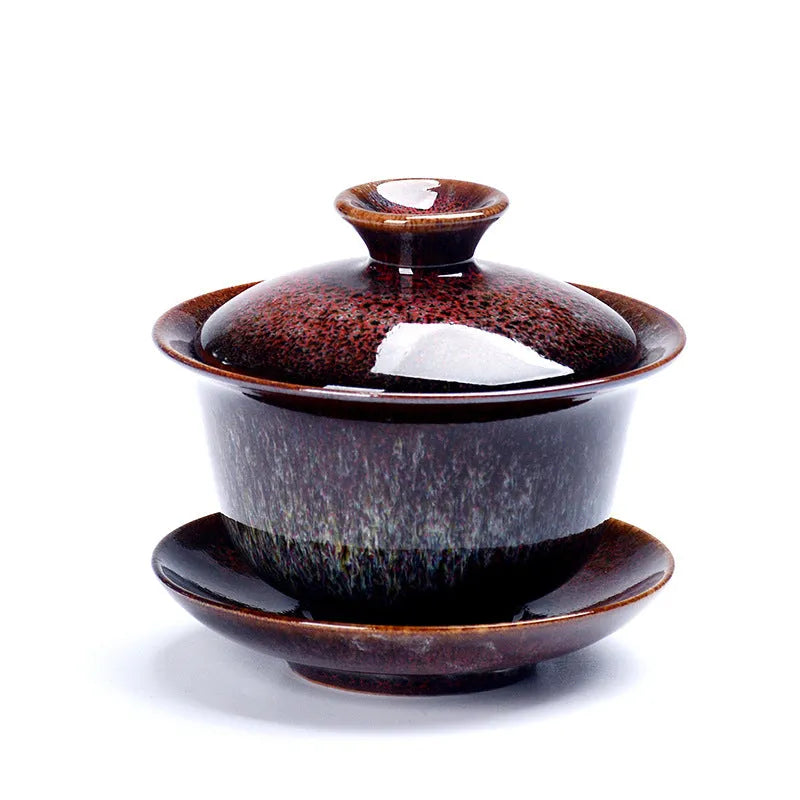 Handcrafted ceramic three-piece tea set with covered bowl and teacup in transmutation glaze finish