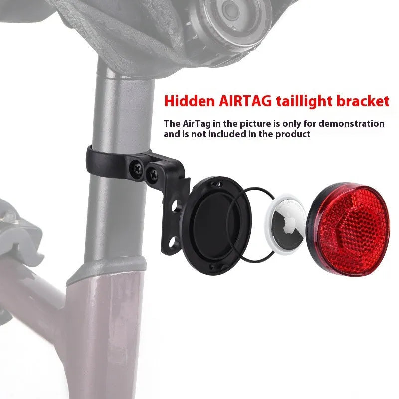 Red plastic anti-theft bicycle taillight bracket mounted on a bike seat post.