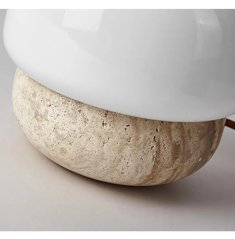 Cream-coloured retro glass bedside lamp with a button switch on its base.