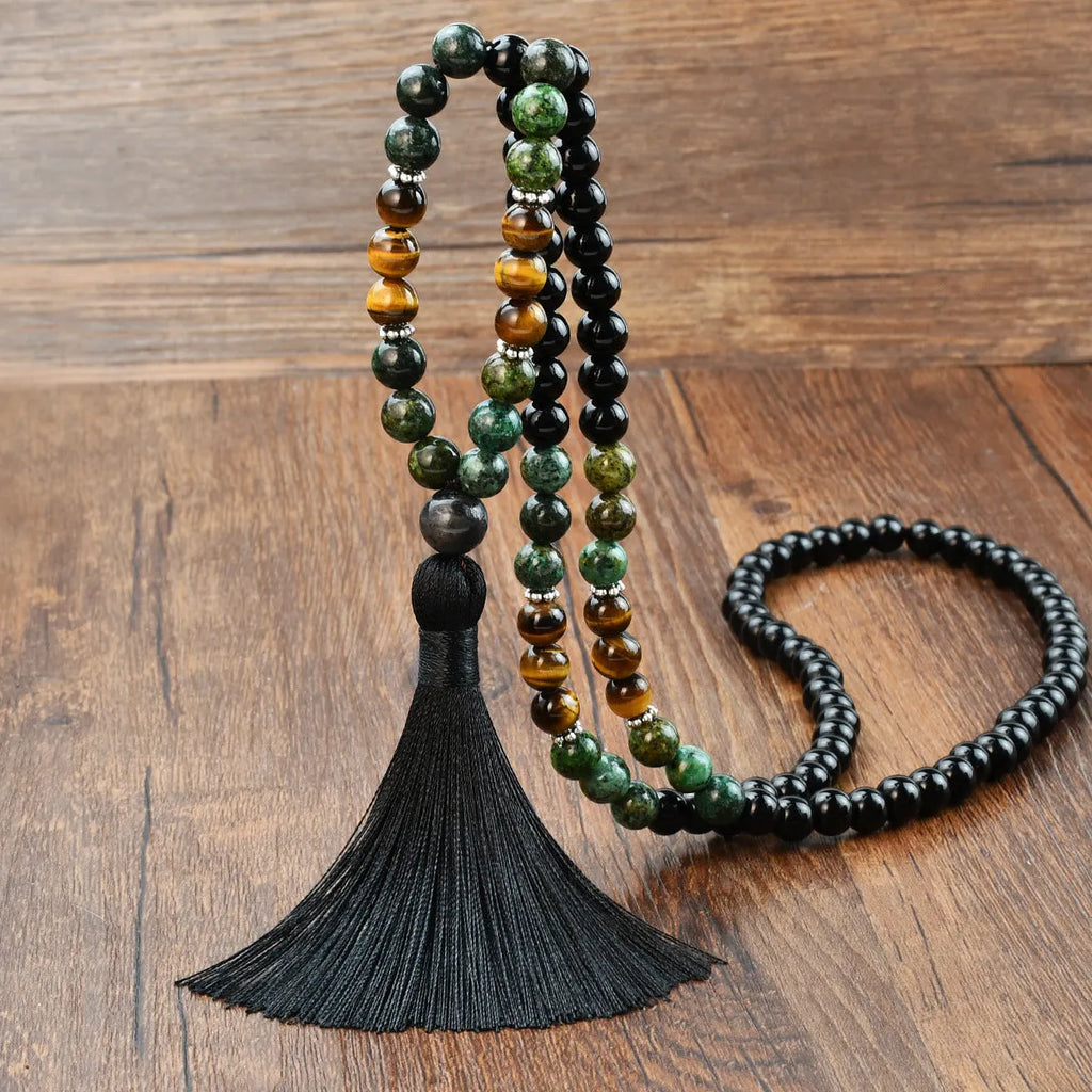Long 108-bead natural stone necklace with a geometric tassel pendant in bohemian style.