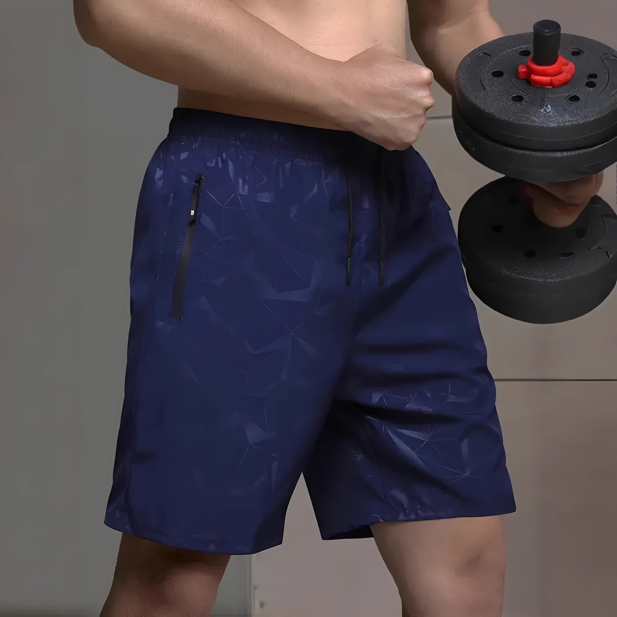 A pair of men's loose-fitting black sports shorts with an elasticated waistband, laid flat.