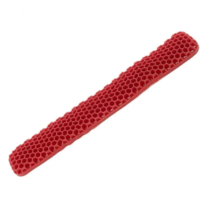 Polymer double-sided wrist rest in blue with hollow grid pattern for keyboard and mouse support