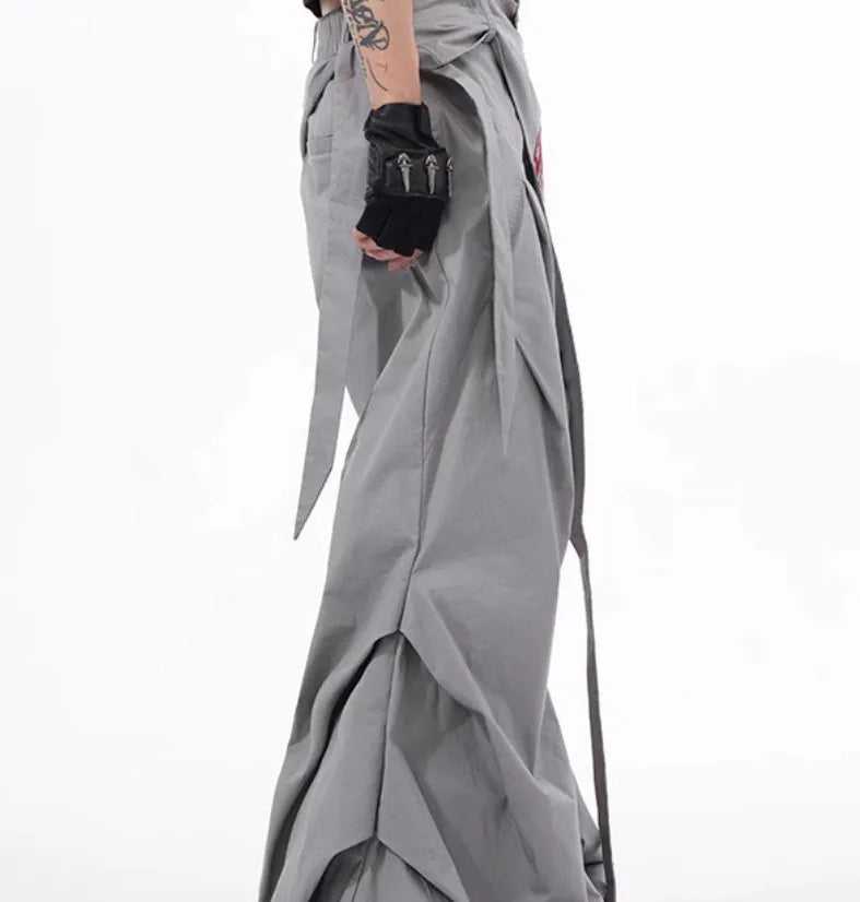 Boy modelling black Korean-style wide-leg summer trousers in a casual setting.