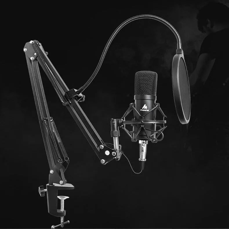 Black wired capacitor microphone on cantilever frame with shockproof support and sponge head for computer recording