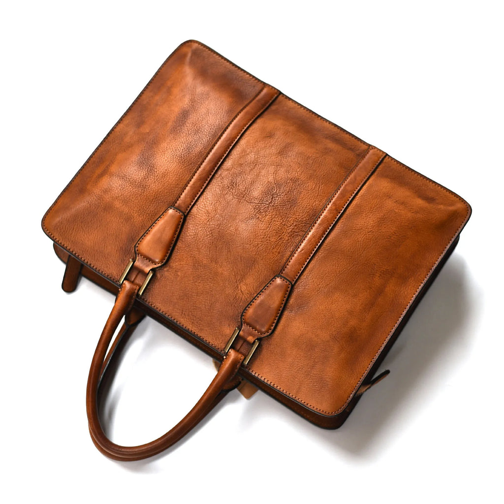 Men's brown leather horizontal business handbag with zipper closure showing retro design
