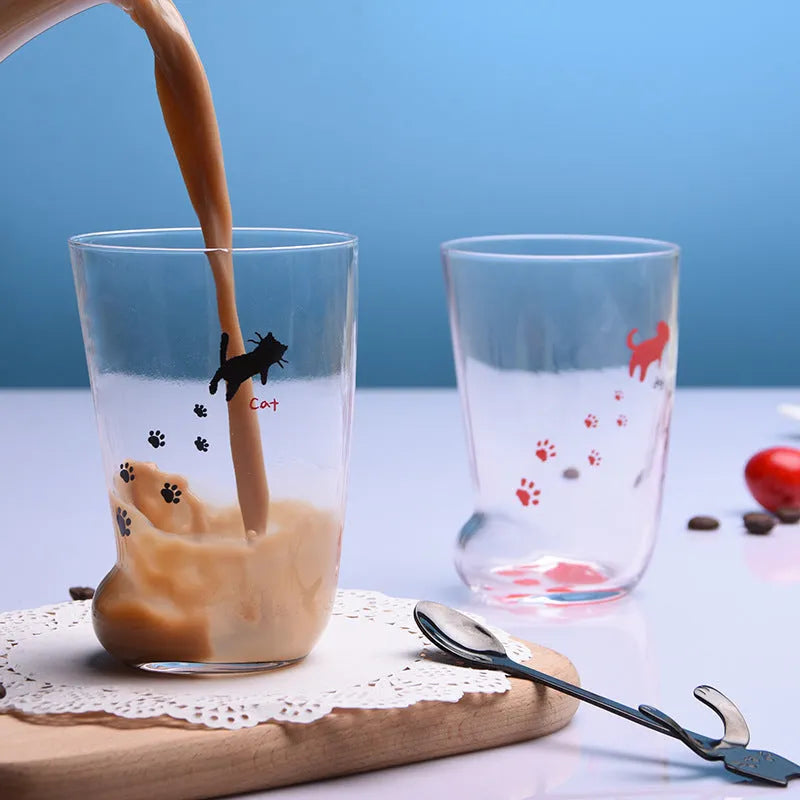 Creative cat paw shaped glass mug with 300ml capacity and frosted texture on a desk