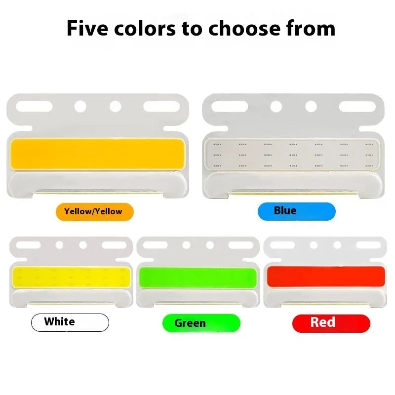 Waterproof aluminium alloy COB LED truck side light in red, mounted near vehicle tyre.