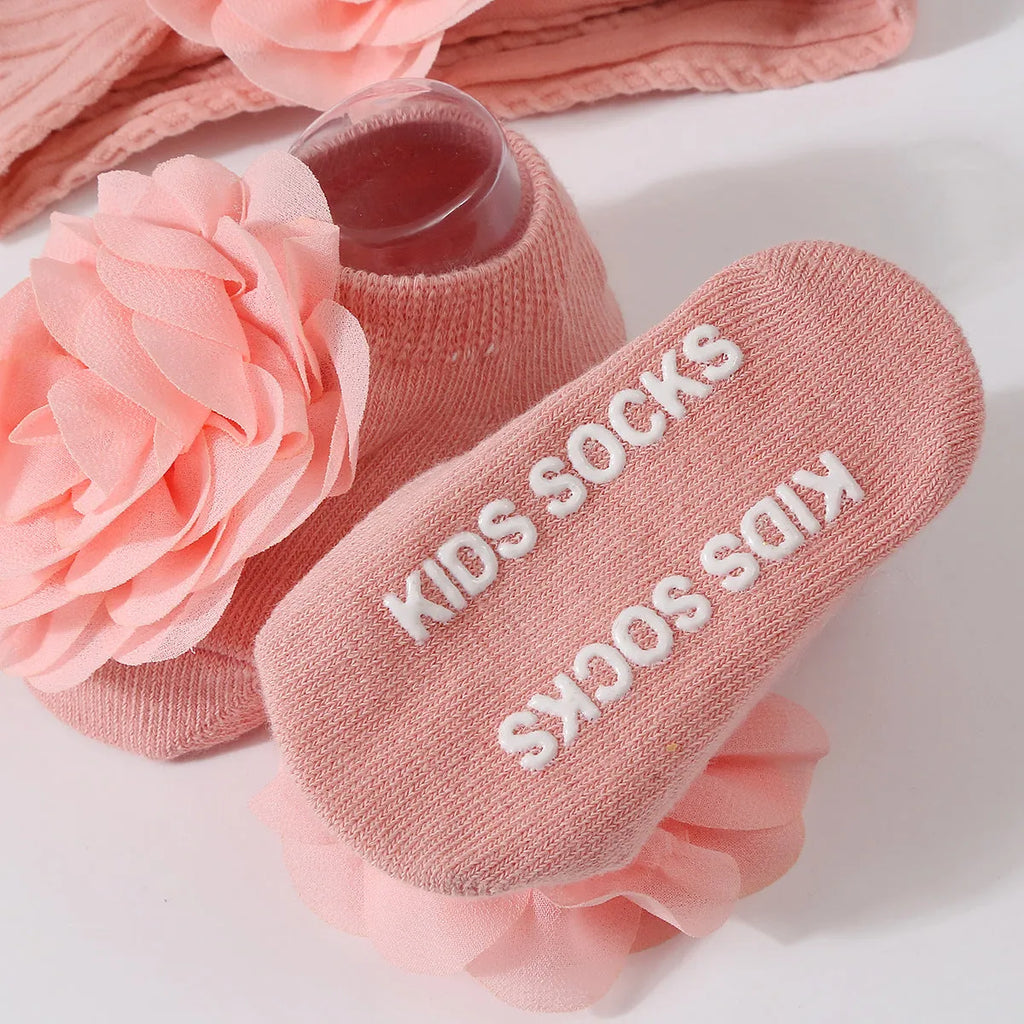 Baby hair band and socks set in nylon with flower-lifting design, available in multiple colours