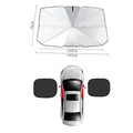 Car sun umbrella made from titanium silver glue and impact cloth with telescopic arms, resting on a car windscreen interior