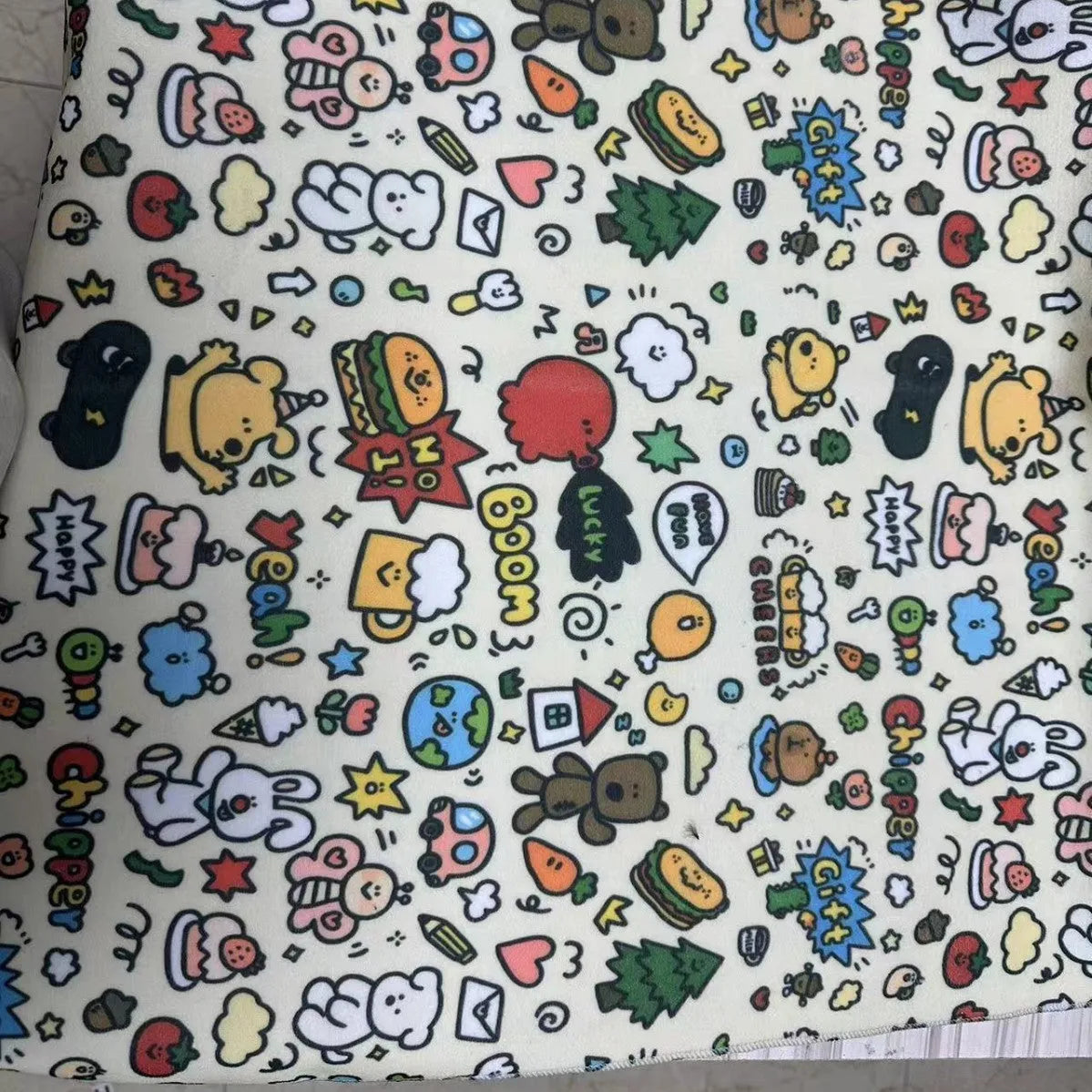 Colourful cartoon animal print nylon cosmetic bag in large, medium, and small sizes.