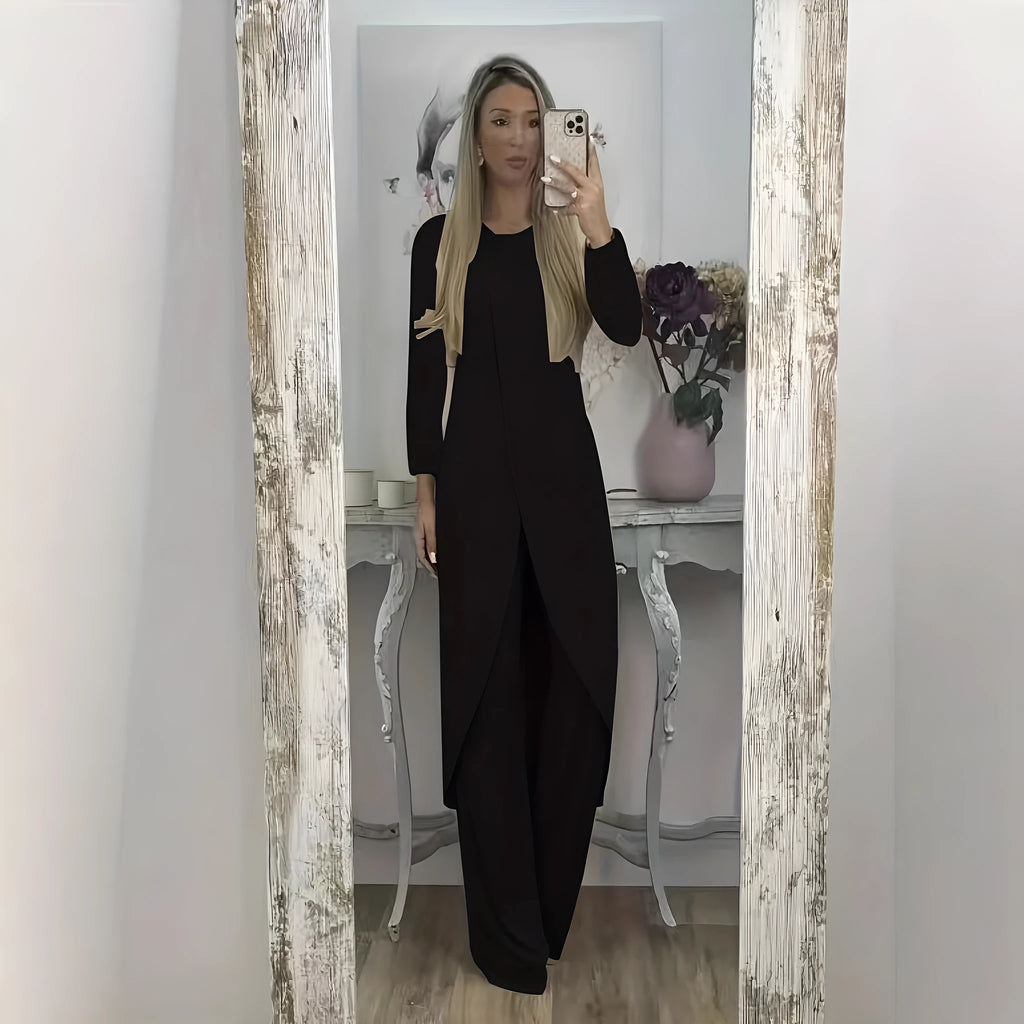 Casual long sleeve two-piece loungewear set in a neutral colour, showing the loose round neck top and matching trousers.