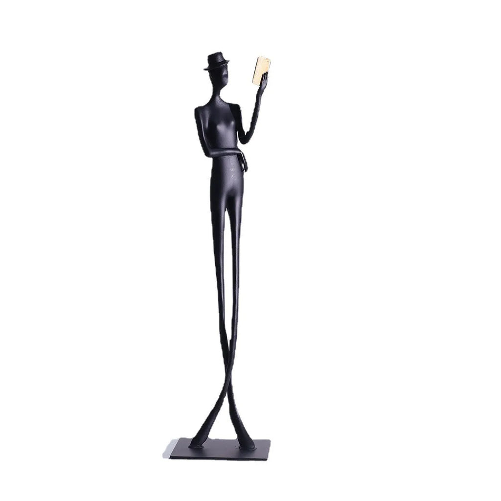 Black aluminium reading woman desktop sculpture with modern geometric design