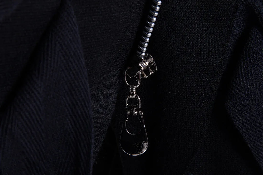 Men's black low crotch cross trousers with tapered cone leg and small hem on a plain background