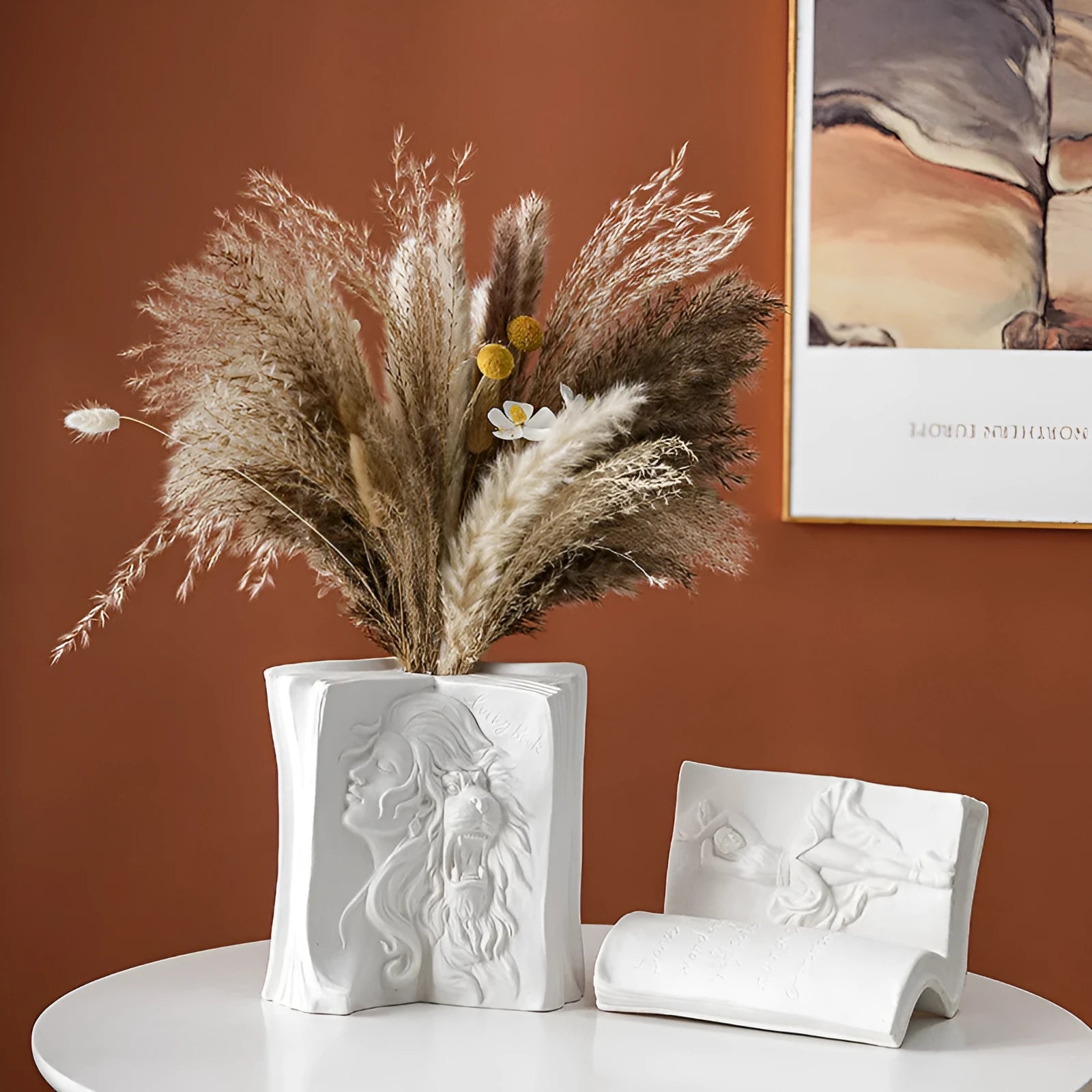 Ceramic book stand with glazed finish in a modern minimalist design on a desktop.