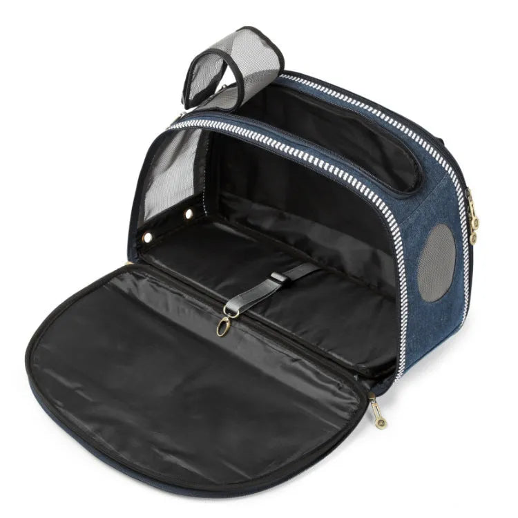 Blue cartoon-patterned denim pet nappy bag with shoulder strap.