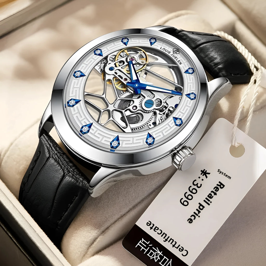 Men's silver mechanical watch with white dial, blue hands, and black leather strap on wrist