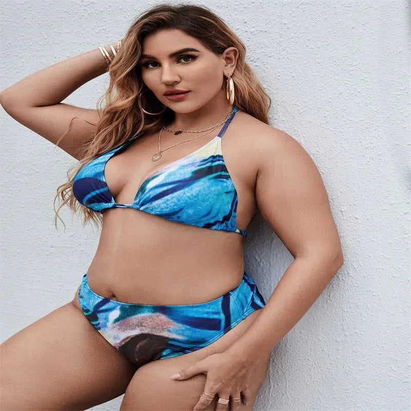 Sapphire blue women's bikini three-piece set on a hanger.