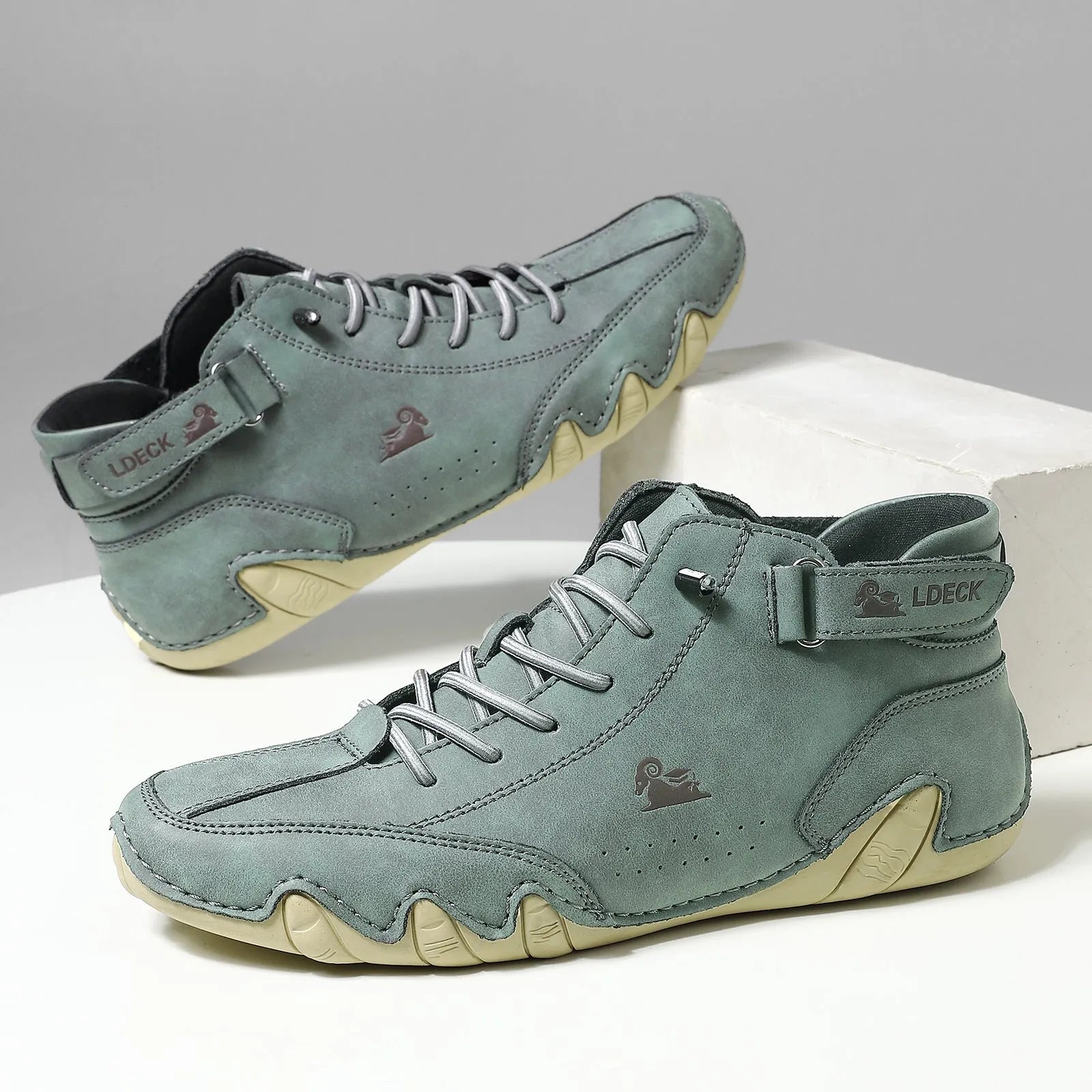 Men's khaki high-top ankle boots with round toe and flat heel on a white background.