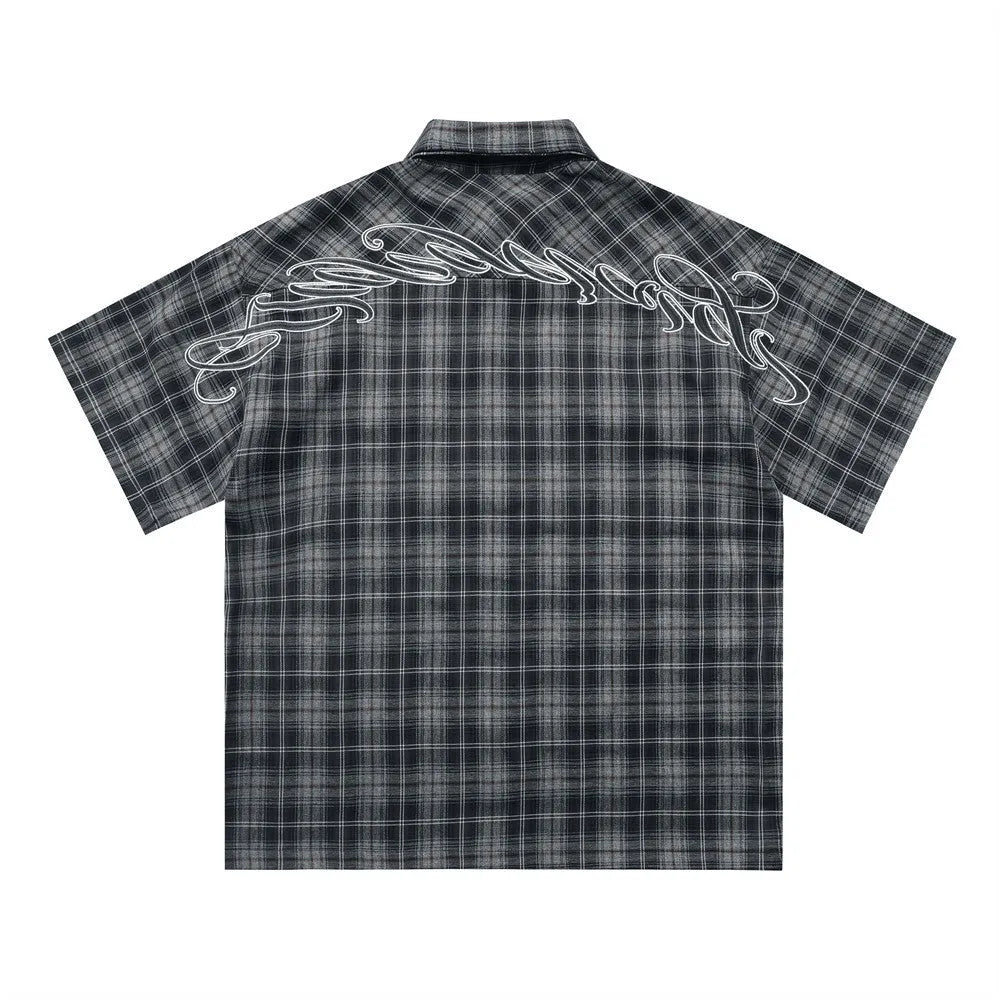 Men's black plaid short sleeve shirt with embroidered letter detail and loose fit design