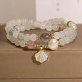 Women's crystal bracelet with artistic ginkgo leaf pendant and rhinestone accents