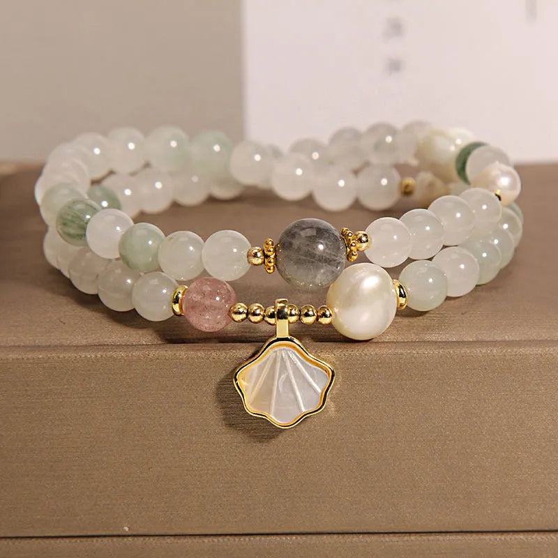 Women's crystal bracelet with artistic ginkgo leaf pendant and rhinestone accents