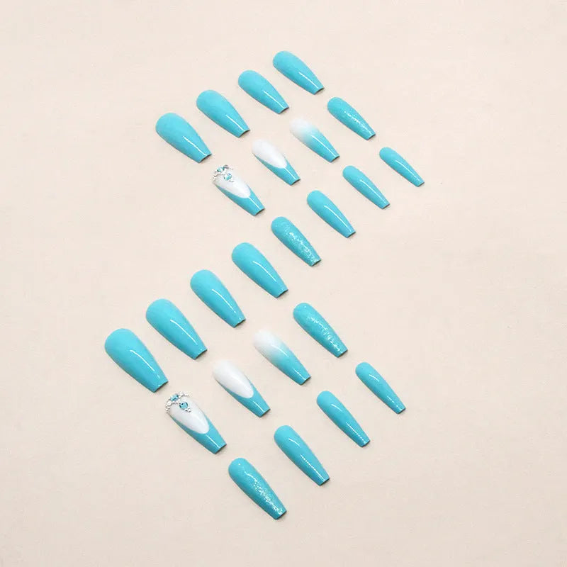 Long ballet style false nails with solid smart blue diamond colour and adhesive glue