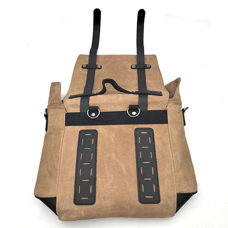 Black waterproof canvas motorcycle side bag with cowhide trim mounted on a bike