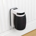 White automatic cat self groomer brush mounted in corner with soft silicone bristles