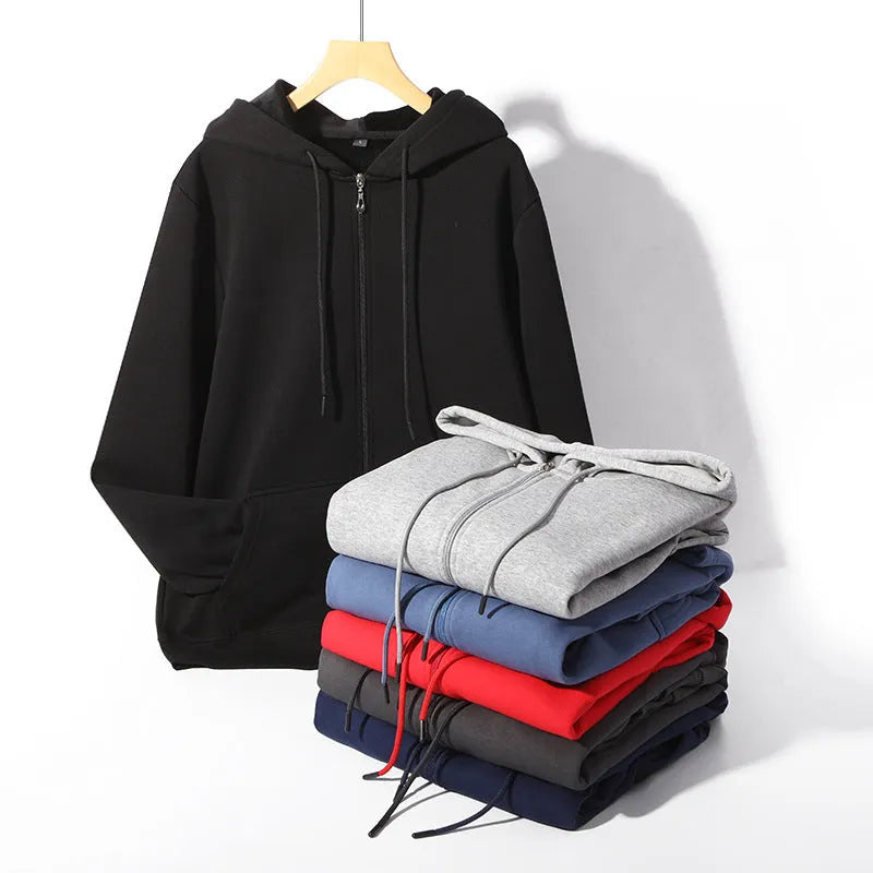 A beige men's heavyweight hooded zip-up sweater showing kangaroo pockets and a loose fit on a man.