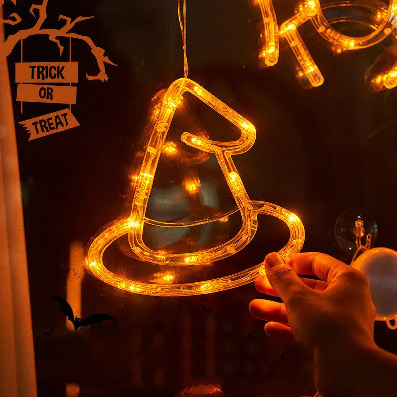 Seven Halloween LED hanging lights with spider, pumpkin and ghost designs featuring suction cups
